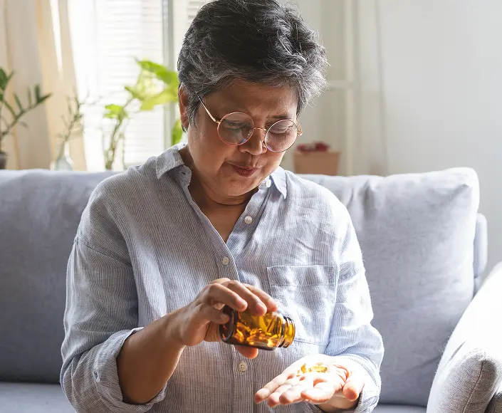 Caregiver assisting an elderly patient at home